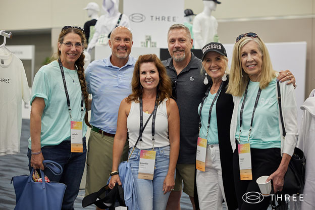 a group of enthusiastic attendees at the power of three convention in anaheim